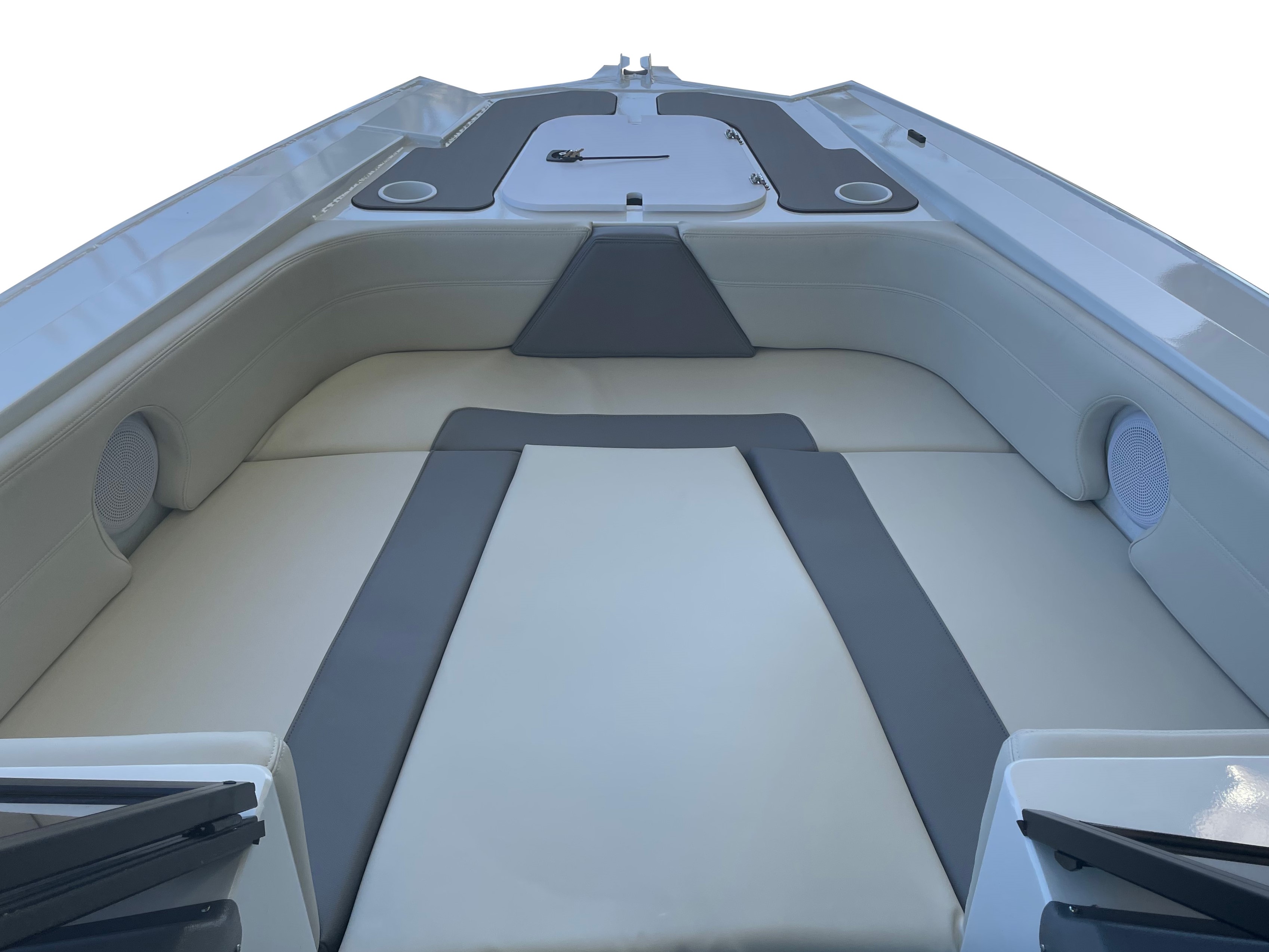 Interior bow view of a Quintrex boat featuring white and grey upholstered sun pad seating and storage hatches.