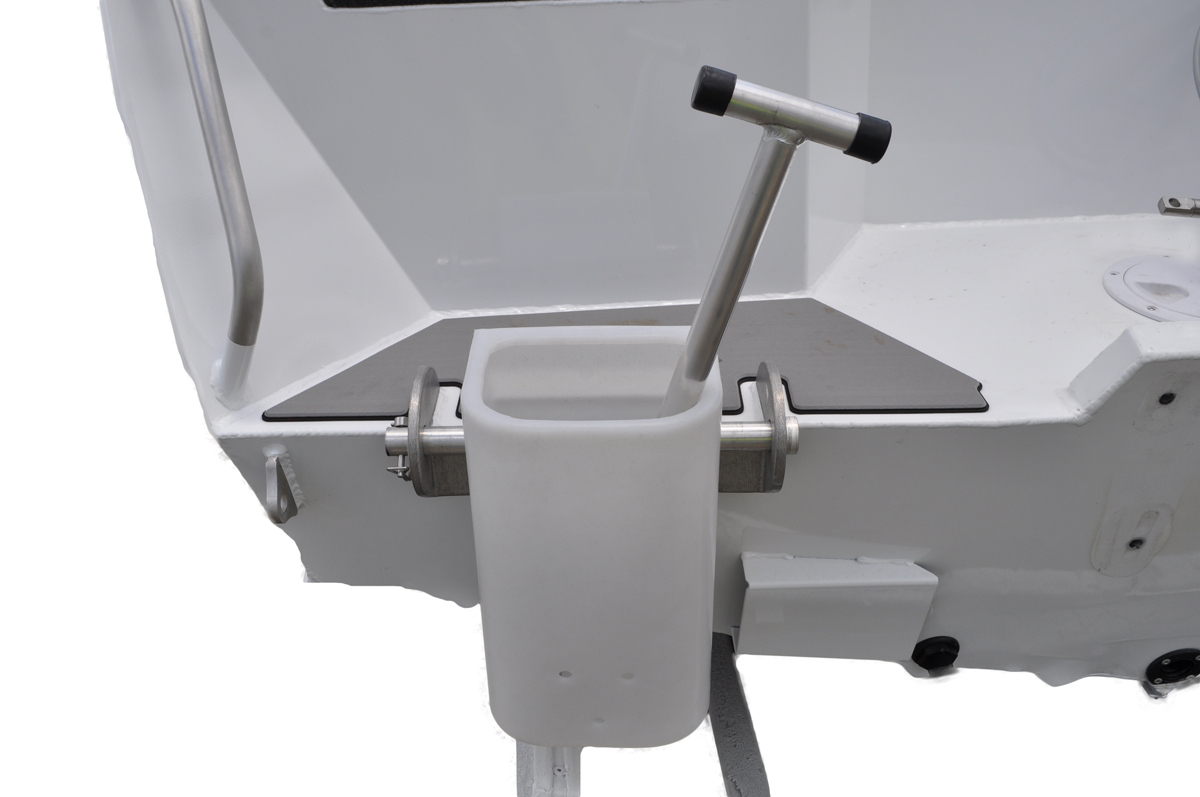 Close-up of a white plastic bait container and metal T-bar handle mounted on the rear of a boat.